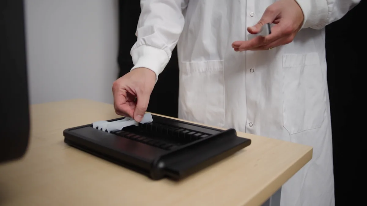 Technician loading specimens onto a LabsCubed tray